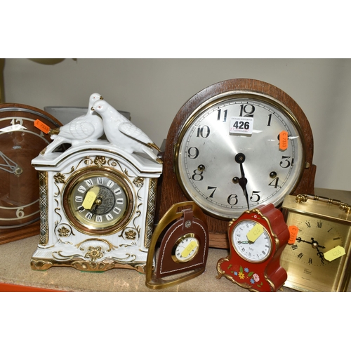 426 - A COLLECTION OF SEVEN MANTEL CLOCKS, comprising a large 1930s style wooden cased Westminster chimes ... 