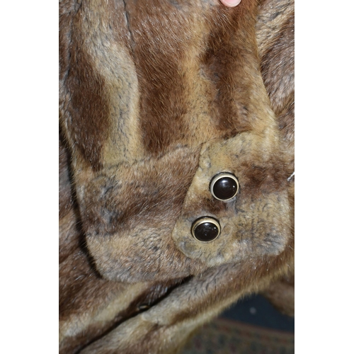 439 - A LADIES BELTED FUR COAT, light brown fur, button detail on cuffs, belted, approximately UK size 12/... 