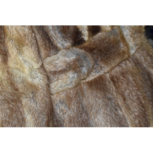 439 - A LADIES BELTED FUR COAT, light brown fur, button detail on cuffs, belted, approximately UK size 12/... 