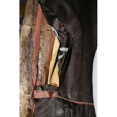 439 - A LADIES BELTED FUR COAT, light brown fur, button detail on cuffs, belted, approximately UK size 12/... 