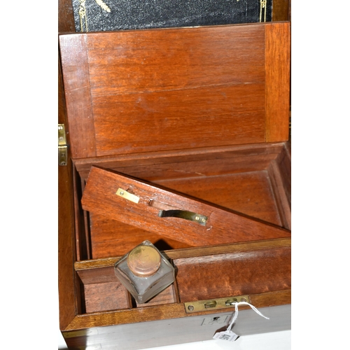 445 - A VICTORIAN WALNUT AND BRASS BOUND WRITING SLOPE, the interior fitted with tooled black leather writ... 