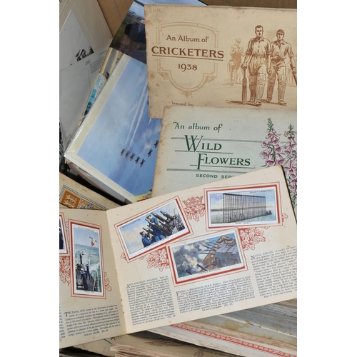 447 - ONE BOX OF CIGARETTE CARDS, POSTCARDS & EPHEMERA to include thirty-nine 1d type albums of cigarette ... 