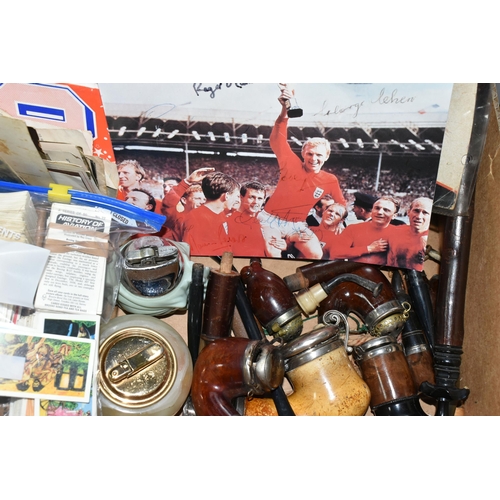 454 - ONE BOX OF EPHEMERA to include pipe bowls, 1966 World Cup signed photographs, a postcard album, ciga... 