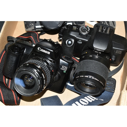 456 - A BOX CONTAINING THREE CANON FILM CAMERAS, comprising an EOS 1000F N, fitted with a Canon zoom lens ... 