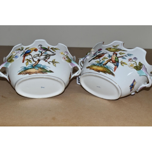 484 - A PAIR OF LATE 19TH / EARLY 20TH CENTURY CONTINENTAL PORCELAIN TWIN HANDLED CACHE-POT PLANTERS, the ... 