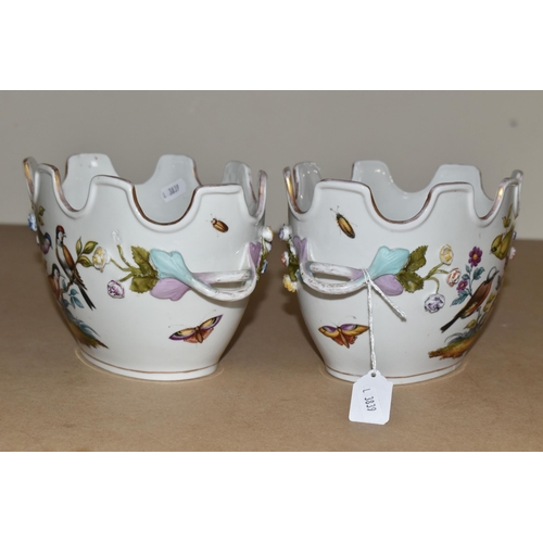 484 - A PAIR OF LATE 19TH / EARLY 20TH CENTURY CONTINENTAL PORCELAIN TWIN HANDLED CACHE-POT PLANTERS, the ... 