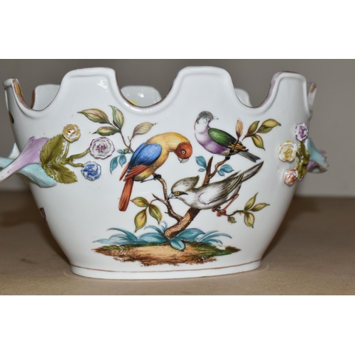 484 - A PAIR OF LATE 19TH / EARLY 20TH CENTURY CONTINENTAL PORCELAIN TWIN HANDLED CACHE-POT PLANTERS, the ... 