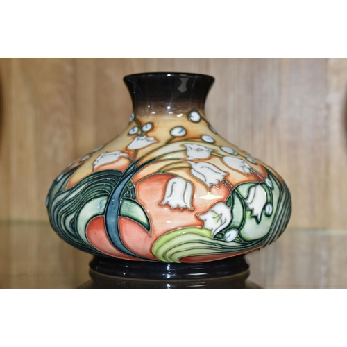 494 - A MOORCROFT POTTERY LIMITED EDITION SQUAT BALUSTER VASE DECORATED WITH A LILY OF THE VALLEY DESIGN, ... 