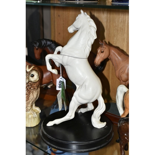 498 - SIX ROYAL DOULTON / BESWICK HORSES / PONIES AND TWO BESWICK OWL LIQUEUR FLASKS, the horses and ponie... 