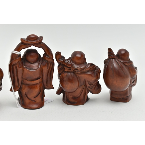 93 - FOUR 20TH CENTURY CARVED TREEN OKIMONO AND A NETSUKE, all in the form of standing buddha, all with i... 