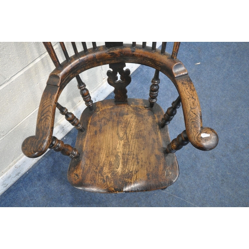 1203 - A 19TH CENTURY STAINED ELM WINDSOR ARMCHAIR, with spindled back rest, turned supports, legs and stre... 