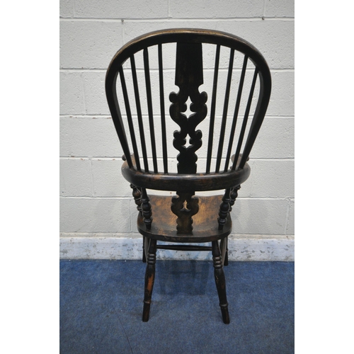 1203 - A 19TH CENTURY STAINED ELM WINDSOR ARMCHAIR, with spindled back rest, turned supports, legs and stre... 