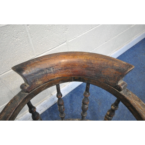 1204 - A 19TH CENTURY ELM AND BEECH BOW TOP CAPTAINS CHAIR, with spindled supports, turned legs and stretch... 