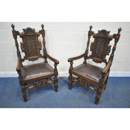 1206 - A PAIR OF EARLY 20TH CENTURY OAK THRONE CHAIRS, carved with floral crest, flanked by two finials, th... 