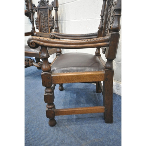 1206 - A PAIR OF EARLY 20TH CENTURY OAK THRONE CHAIRS, carved with floral crest, flanked by two finials, th... 