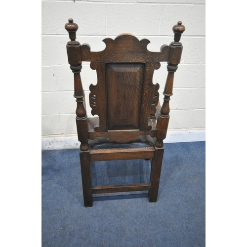 1206 - A PAIR OF EARLY 20TH CENTURY OAK THRONE CHAIRS, carved with floral crest, flanked by two finials, th... 