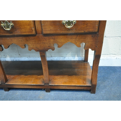 1214 - IN THE MANNER OF TITCHMARSH AND GOODWIN, A SOLID OAK DRESSER, the top being a three tier plate rack,... 