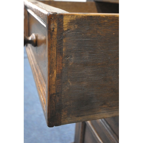 1215 - IN THE MANNER OF TITCHMARSH AND GOODWIN, A SOLID OAK CHEST OF TWO SHORT OVER TWO LONG DRAWERS, width... 