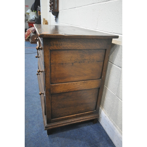 1215 - IN THE MANNER OF TITCHMARSH AND GOODWIN, A SOLID OAK CHEST OF TWO SHORT OVER TWO LONG DRAWERS, width... 