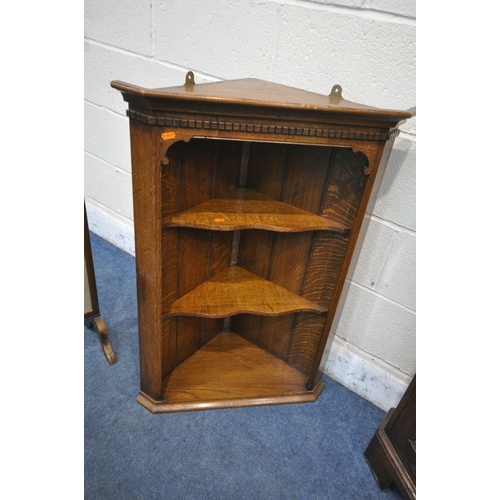 1216 - IN THE MANNER OF TITCHMARSH AND GOODWIN, A SOLID OAK CORNER CUPBOARD, with a glazed door, above a cu... 