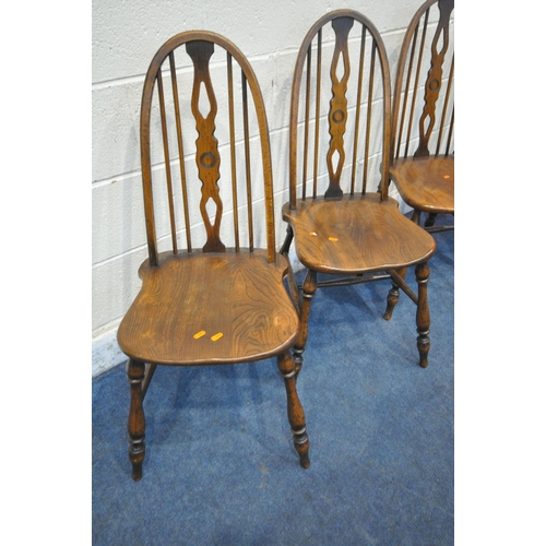 1220 - A SET OF FOUR REPRODUCTION ELM SEATED SPINDLE BACK CHAIRS, on turned legs and stretchers (condition ... 