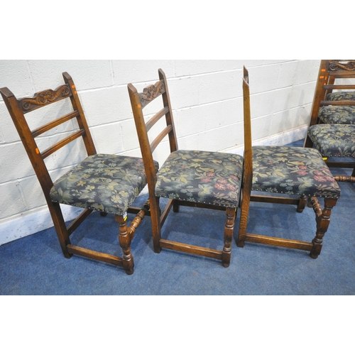 1222 - A SET OF SIX REPRODUCTION OAK LADDER BACK DINING CHAIRS, the top rail with scrolled carving, dark bl... 