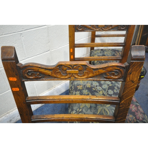 1222 - A SET OF SIX REPRODUCTION OAK LADDER BACK DINING CHAIRS, the top rail with scrolled carving, dark bl... 