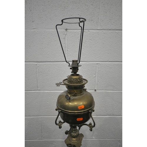 1226 - A HEAVY HINKS BRASS STANDARD LAMP, converted from a paraffin lamp, with a Corinthian pillar, on a sq... 