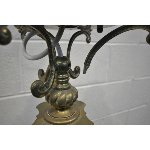 1226 - A HEAVY HINKS BRASS STANDARD LAMP, converted from a paraffin lamp, with a Corinthian pillar, on a sq... 