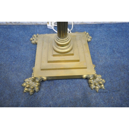 1226 - A HEAVY HINKS BRASS STANDARD LAMP, converted from a paraffin lamp, with a Corinthian pillar, on a sq... 