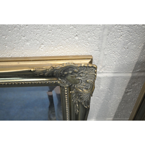 1231 - A GILT WOOD FRAME BEVELLED EDGE WALL MIRROR, with foliate detail to each corner, 117cm x 92cm, along... 