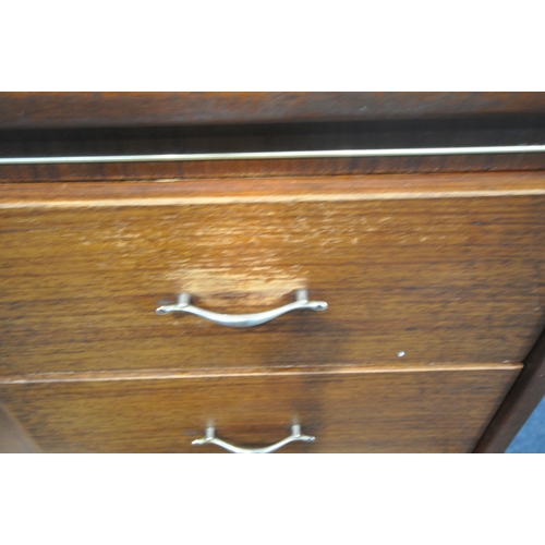 1241 - A MID CENTURY BEAUTILITY TOLA AND BLACK HIGHBOARD, fitted with two banks of two drawers, flanking a ... 