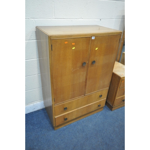 1249 - A 20TH CENTURY OAK TWO PIECE BEDROOM SUITE, comprising a tallboy with two cupboard doors, above two ... 