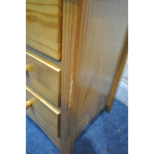 1250 - A JULIEN BOWEN PINE THREE PIECE BEDROOM SUITE, comprising a chest of two short over four long drawer... 