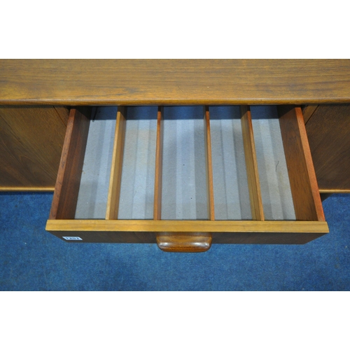 1251 - A MID CENTURY TEAK G PLAN SIDEBOARD, fitted with double cupboard doors, four recessed drawers, top d... 