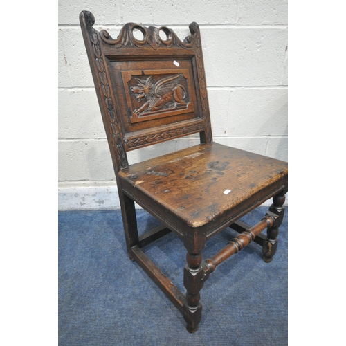 1269 - A 17TH CENTURY OAK LANCASHIRE CHAIR/HALL CHAIR, with scrolled crest, backrest depicting a mythical w... 