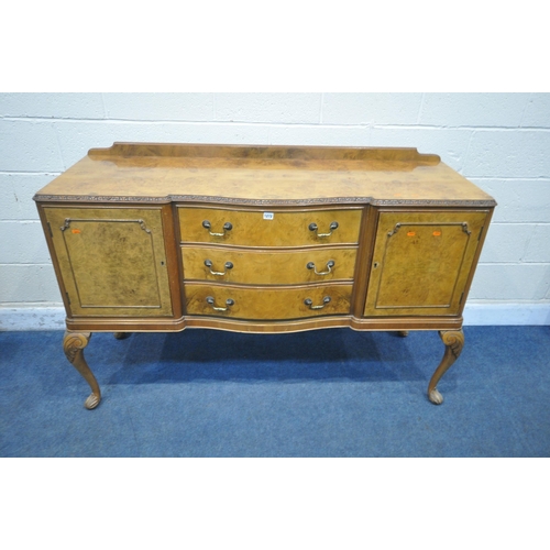 1272 - A QUEEN ANNE STYLE WALNUT SIDEBOARD, fitted with two cupboard doors, flanking three drawers, top dra... 