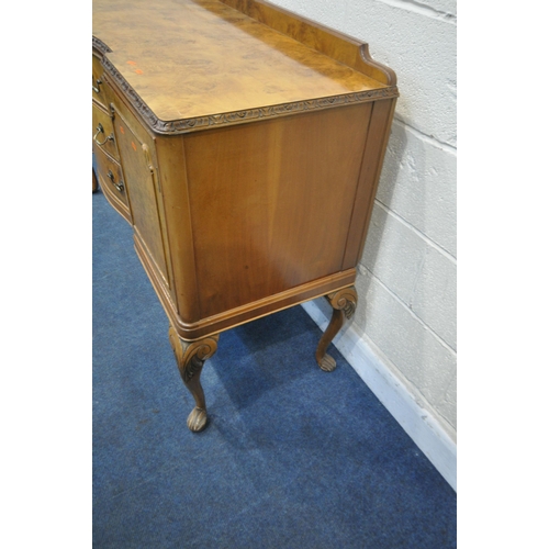 1272 - A QUEEN ANNE STYLE WALNUT SIDEBOARD, fitted with two cupboard doors, flanking three drawers, top dra... 