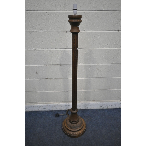 1281 - A 20TH CENTURY OAK STANDARD LAMP, with turned and carved pillar support, on a domed and stepped base... 