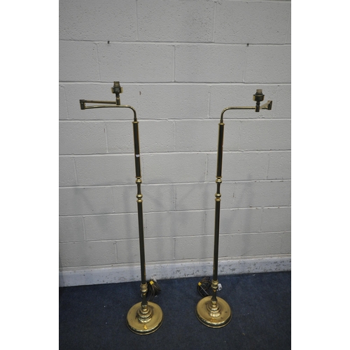 1288 - A PAIR OF BRASS STANDARD LAMPS, with a swing arm mechanism, height 157cm (condition report: general ... 