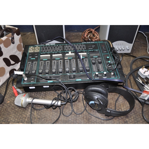 1067 - A REALISTIC SSM-2200 DJ MIXER, a Realistic Stereo mic, a Jem mic, a pair of speakers (one powered) a... 