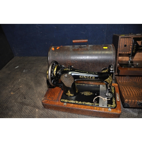 1071 - THREE VINTAGE SEWING MACHINES IN CASES comprising of a manual Singer, an electric Singer (untested)a... 