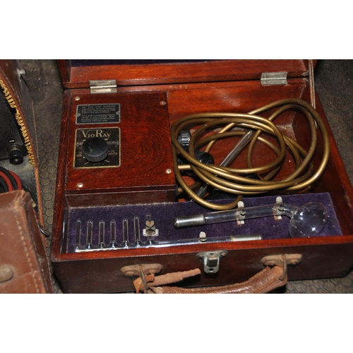 1084 - A VINTAGE AVOMETER in a distressed leather case with probes along with a VioRay scientific machine i... 