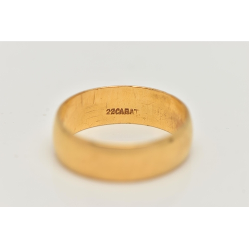 2 - A YELLOW METAL WIDE POLISHED BAND, approximate band width 6.2mm, stamped 22 carat, ring size N, appr... 