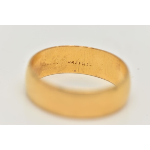 2 - A YELLOW METAL WIDE POLISHED BAND, approximate band width 6.2mm, stamped 22 carat, ring size N, appr... 