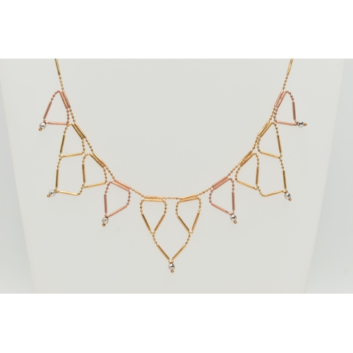 25 - A BI-COLOUR FRINGE NECKLACE, the faceted and tubular design chain suspending triangular fringe drops... 