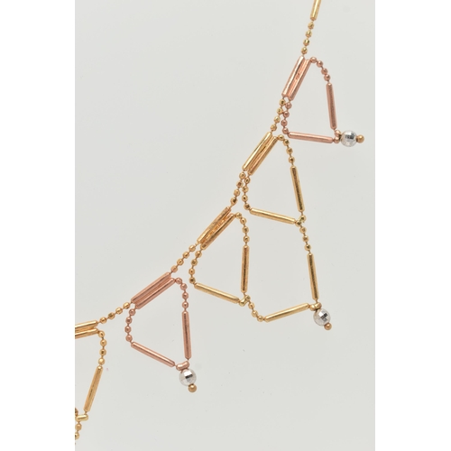 25 - A BI-COLOUR FRINGE NECKLACE, the faceted and tubular design chain suspending triangular fringe drops... 