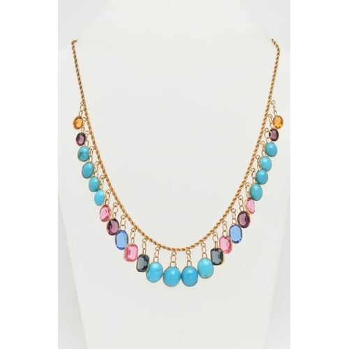 27 - A GEM AND PASTE FRINGE NECKLACE, the rope twist chain suspending oval turquoise cabochons and oval a... 