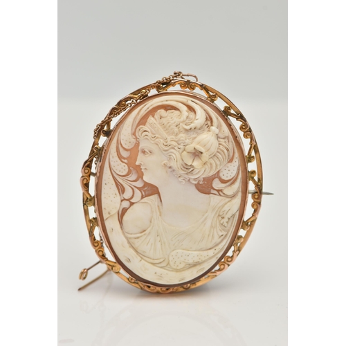 3 - A YELLOW METAL CAMEO BROOCH, of an oval form, carved shell cameo depicting a lady in profile, collet... 