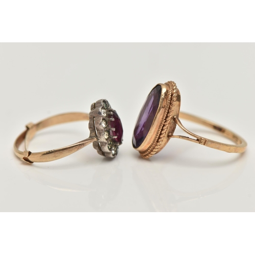 32 - TWO GEM SET RINGS, the first an elongated oval cut amethyst, collet set in yellow gold with rope twi... 